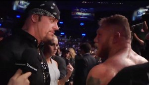 Brock Lesnar and the Undertaker confront each other after Lesnar's fight at UFC 121