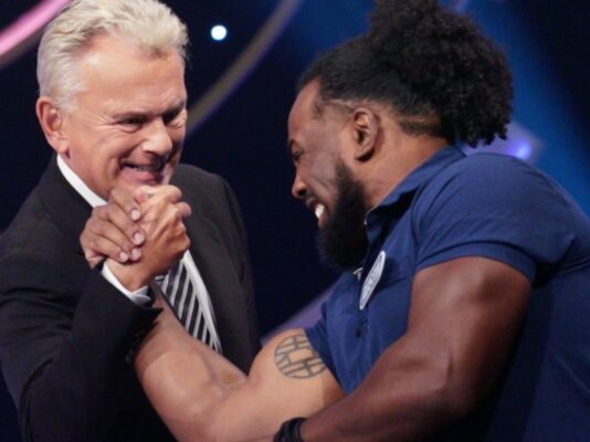 Xavier Woods and Pat Sajak