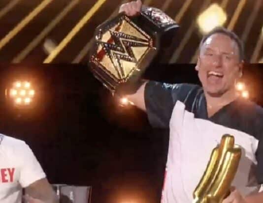 Rey Mysterio Presents Joey Chestnut With WWE Title For Winning “Unfinished Business”