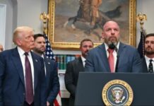 US President Donald Trump listens as WWE CCO Triple H speaks in the Roosevelt Room of the White House in Washington, DC.(AFP)