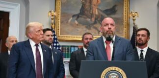 US President Donald Trump listens as WWE CCO Triple H speaks in the Roosevelt Room of the White House in Washington, DC.(AFP)