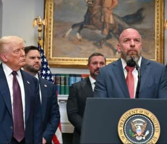 US President Donald Trump listens as WWE CCO Triple H speaks in the Roosevelt Room of the White House in Washington, DC.(AFP)
