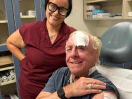 Ric Flair in hospital with nurse.