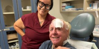 Ric Flair in hospital with nurse.