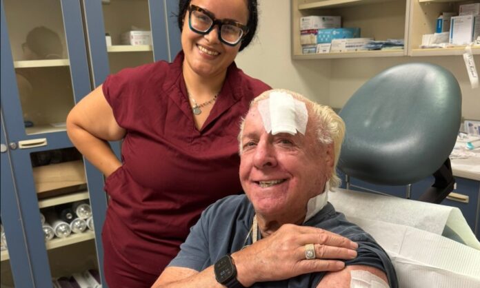 Ric Flair in hospital with nurse.