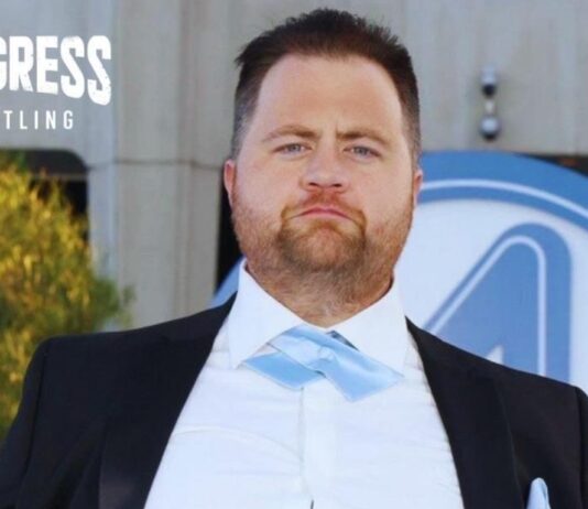 Paul Walter Hauser wears PROGRESS Proteus World Championship at Fantastic Four premiere
