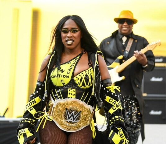 Naomi with her Dad in WWE